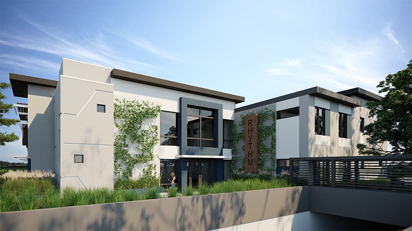 Rendering of Rhythm Living townhouses on a clear day with trees out front